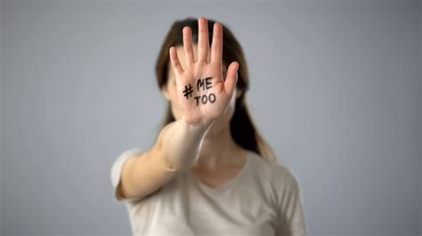 woman with me too sign on hand movement against sexual