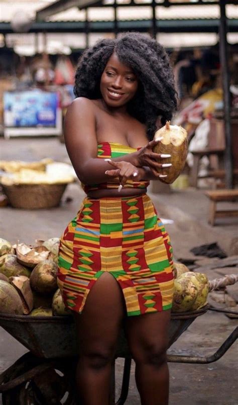 a woman sitting on a bench holding a piece of bread