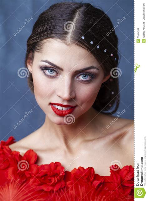 woman traditional spanish flamenco dancer dancing in a red dress stock