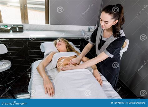 Beautiful Young Woman Having Belly Massage In Modern Medical And