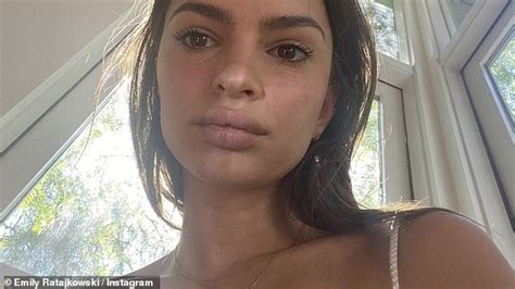pregnant emily ratajkowski shows off her bump while working from her