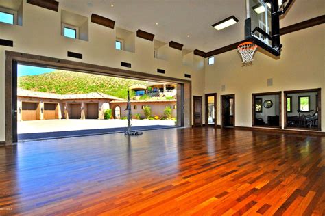 indoor basketball court  hardwood floors  glass doors leading