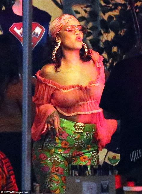 rihanna shows off her nipple piercing in miami daily