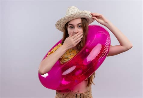 Free Photo Confident Young Girl Wearing Hat And Swim Ring Doing Peace