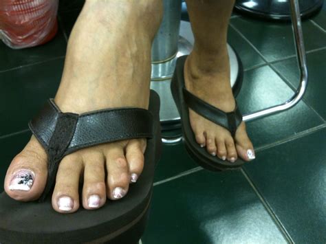 size 9 mature dominican shoeplay flip flops at work