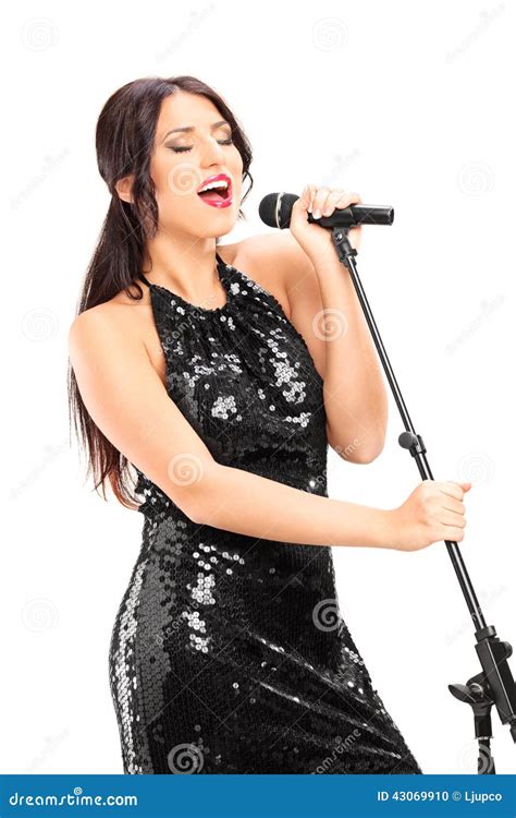 elegant female singer singing  microphone stock photo image