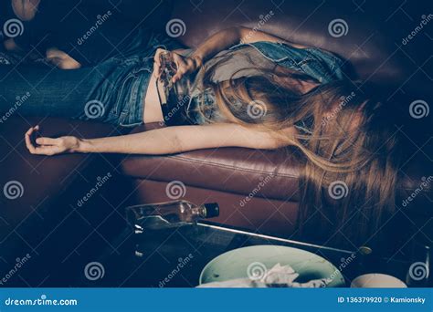 Young Drunk Woman On The Sofa Young Drunk Woman On The Sofa