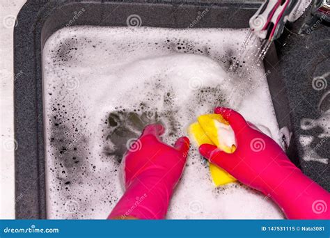 washing plates sink detergent foams stock image image  closeup