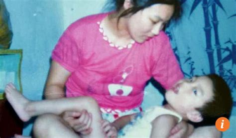 chinese mom refuses to give up disabled son nurtures him
