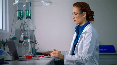 female scientist working  scientist tablet  lab female