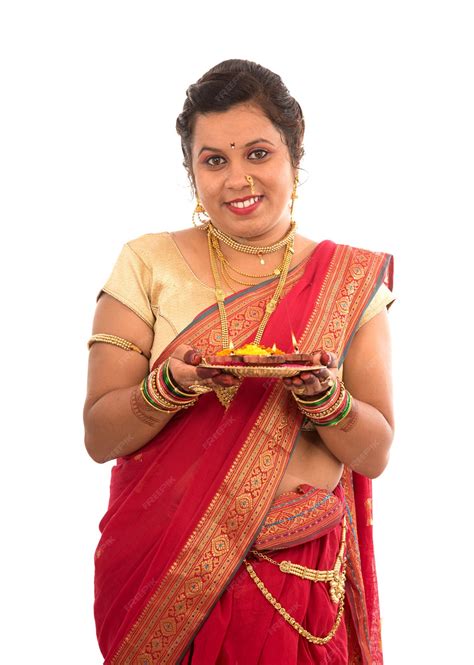Premium Photo Portrait Of A Indian Traditional Girl Holding Pooja