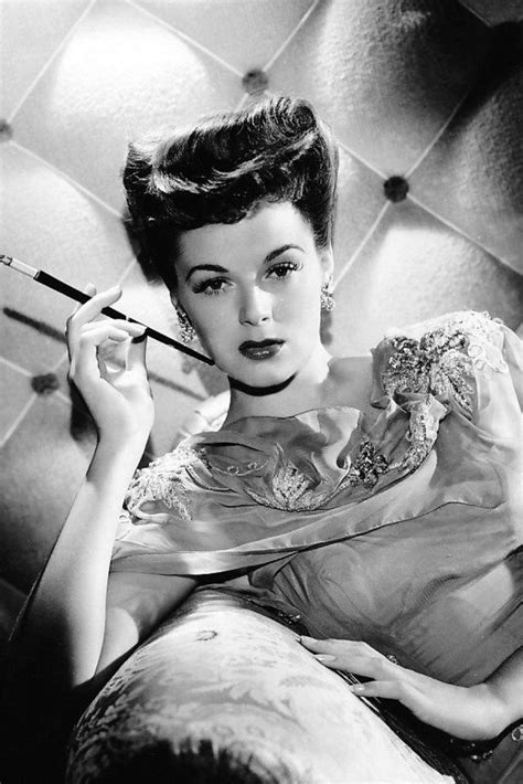 44 Glamorous Photos Of Smoking Beauties From The 1930s And 1960s
