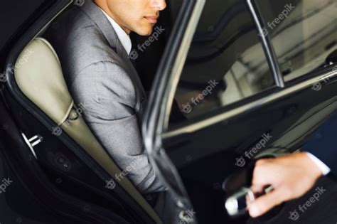 premium photo driver opening door  businessman