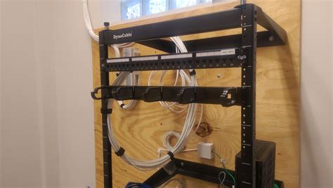 installation  wall mount rack patch panel data cabling anderson technologies