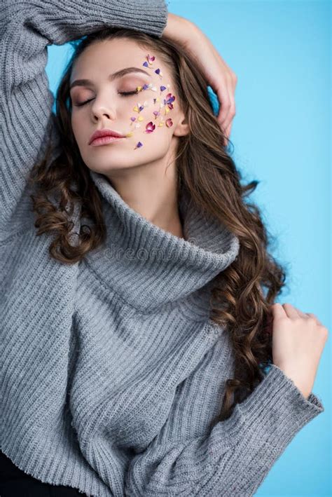 Sensual Young Woman With Closed Eyes And Flowers On Face Posing Stock