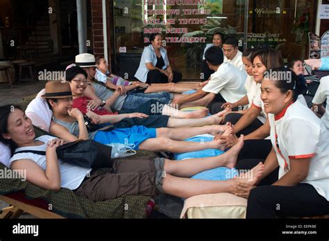chinese people foot massage in khao san road bangkok thailand hippy