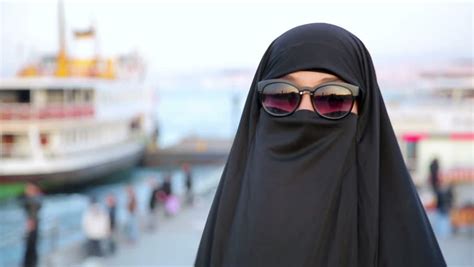 Steadicam Woman Dressed With Black Headscarf Chador