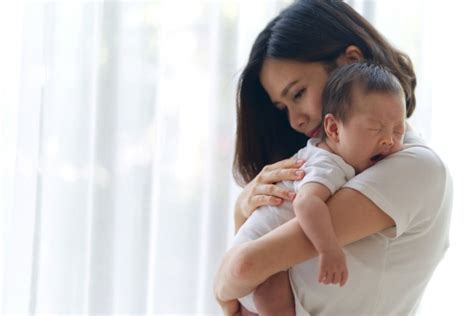 daughter hugging beautiful asian mother smile photo