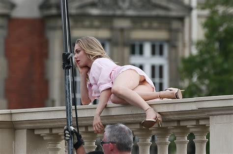 amanda seyfried pussy slip on a ledge on the set of a photoshoot in paris 6 22 16 the