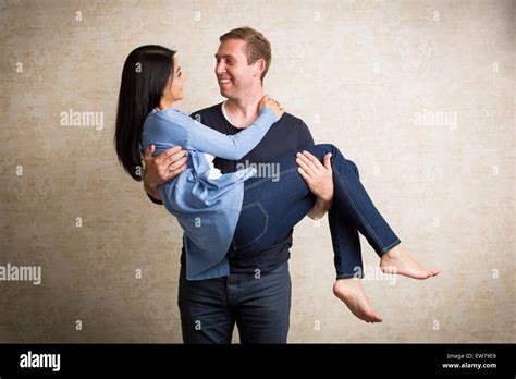 man carrying woman   arms stock photo royalty  image
