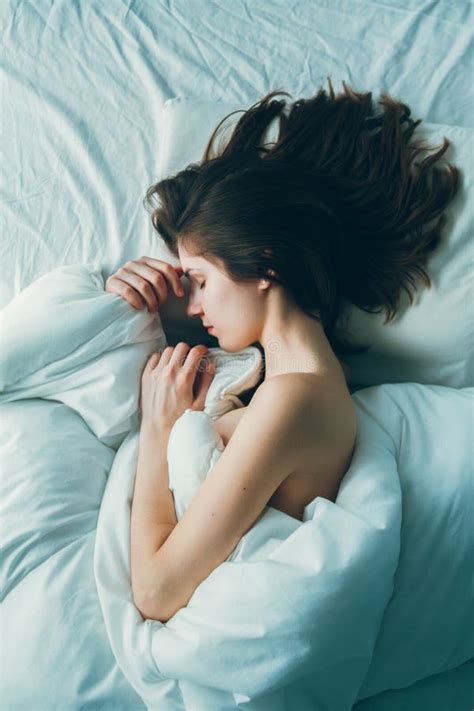Caucasian Woman Lying In Bed Sleeping Her Messy Hair On Pillow Stock