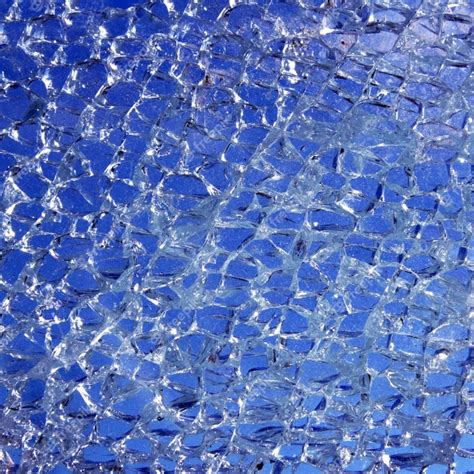 Premium Photo Broken Glass Cracked Over Blue Background