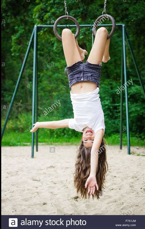 Girl Hanging Upside Down In A Playground Figure Poses Pose Reference