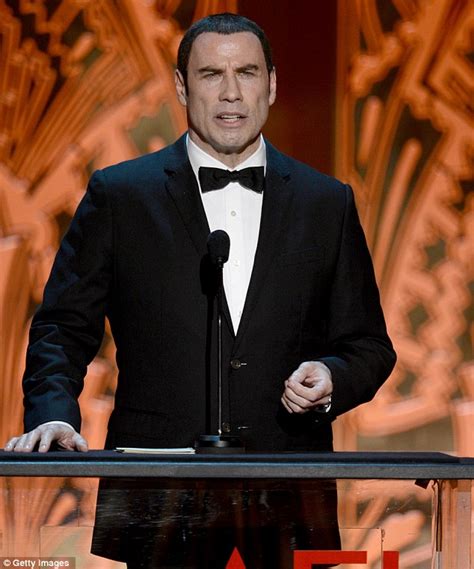 john travolta puts on a brave face to help honour actress shirley maclaine after more