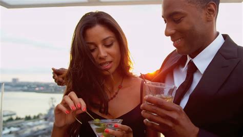stock video of diverse smiling couple talking drinking at 3279401 shutterstock