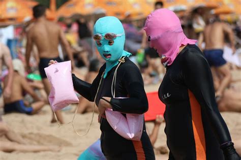 Chinese Beach Goers Opting For Face Kinis And Morphsuits To Protect