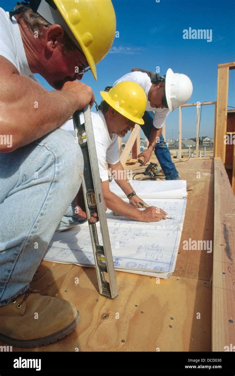 jobsite foreman giving instructions  carpenters  school stock photo