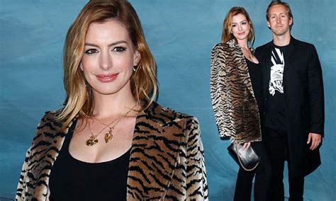 anne hathaway shines in tiger print coat as she puts her