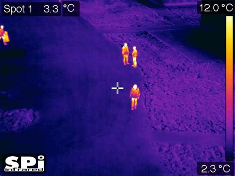 infrared uav drone image  people standing   road  grass spi corp