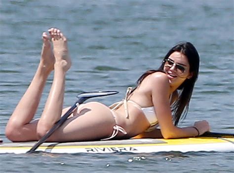 kendall jenner flaunts bikini figure while lounging on a paddleboard