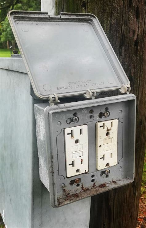 outdoor electrical outlet isolated stock photo image  weathered power