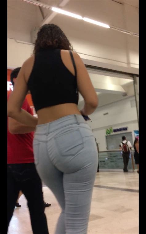 Large Brunette Showing Big Ass With Tight And Light Jeans