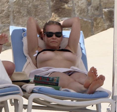 chelsea handler topless sunbathing on a beach