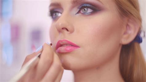 artist applying lipstick  brush  pretty gorgeous woman