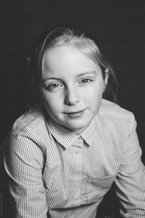 black and white portrait of a tween girl by helen rushbrook