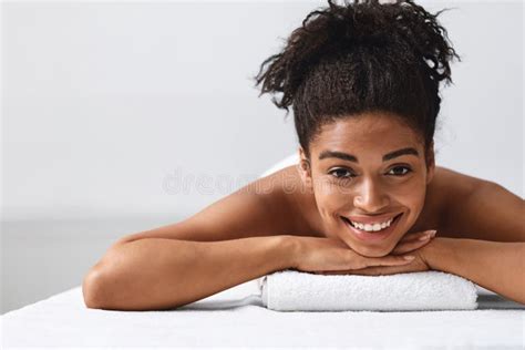 Close Up Of Pretty Black Girl Lying On Massage Table Stock Image