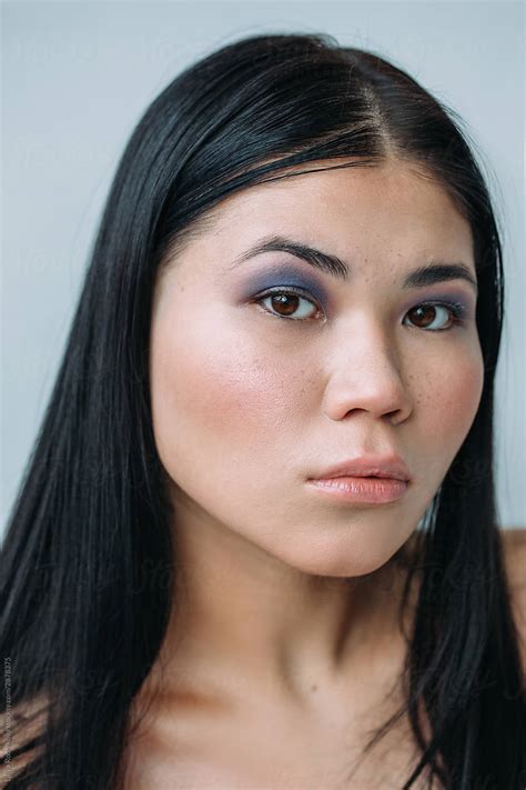attractive asian woman with smoky eyes by stocksy contributor liliya