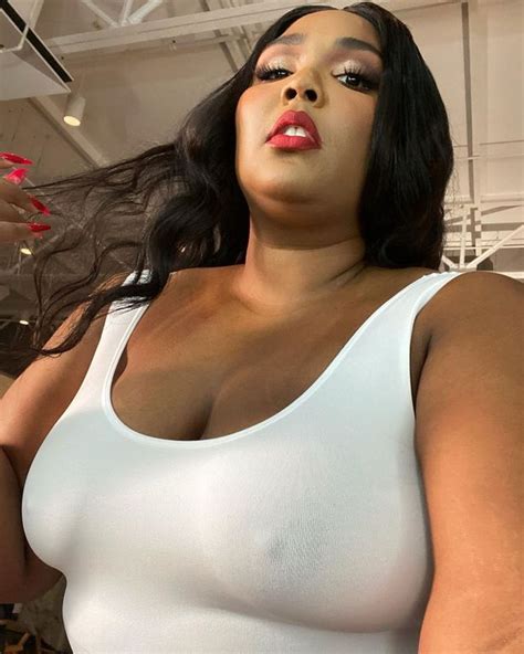 lizzo sizzles as she ditches bra in see through top for