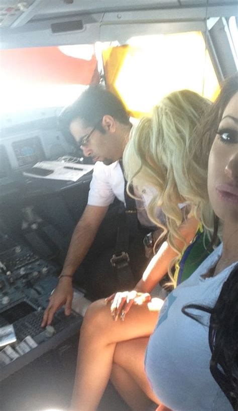 naughty pilot flying from heathrow to new york let s ex porn star in the cockpit 3 pics