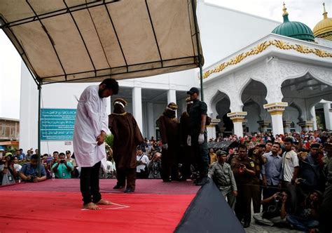 indonesia two gay men publicly caned for having sex