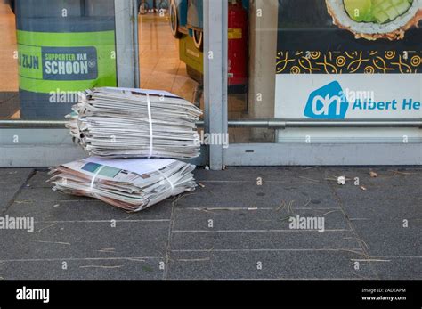delivering newspapers   ah supermarket amsterdam  netherlands  stock photo alamy