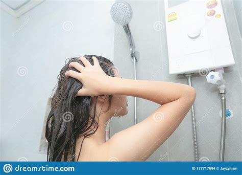 asian women portrait of happy girl taking shower with gel