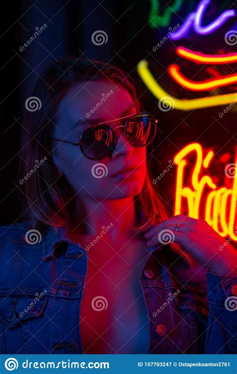 creative sexual portrait of a girl in neon lighting with