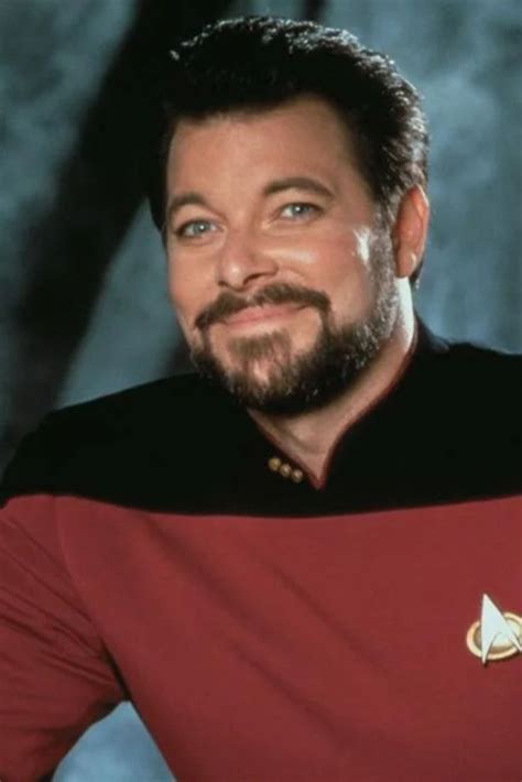 A Man With A Beard Wearing A Star Trek Uniform