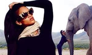 Wild Girl Rihanna Embraces An Elephant As She Continues