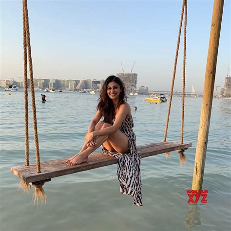 Actress Mouni Roy Hot Stills On Swing In Water Social